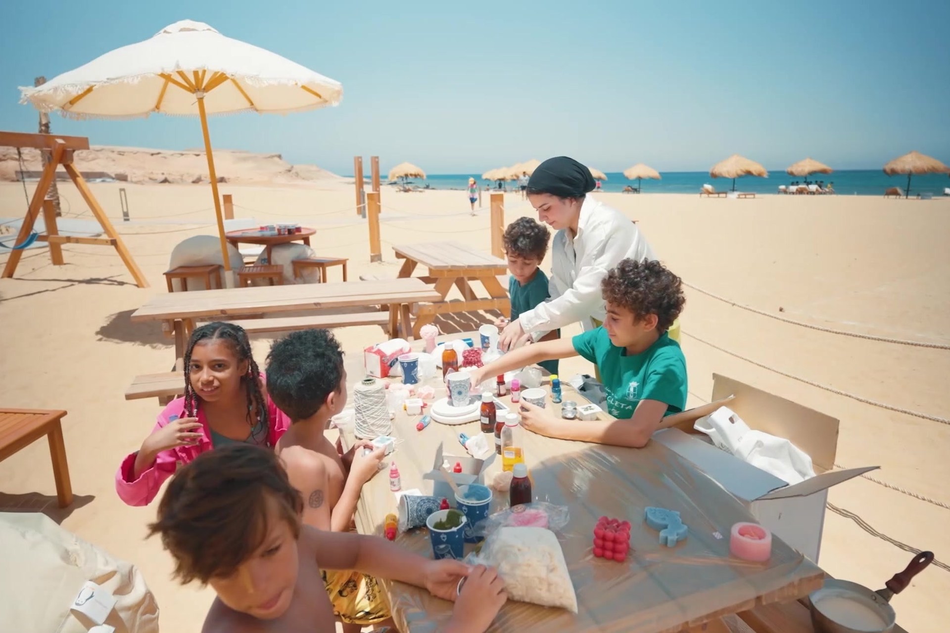 Children taking part in Eid crafts on BOHO Sokhna beach