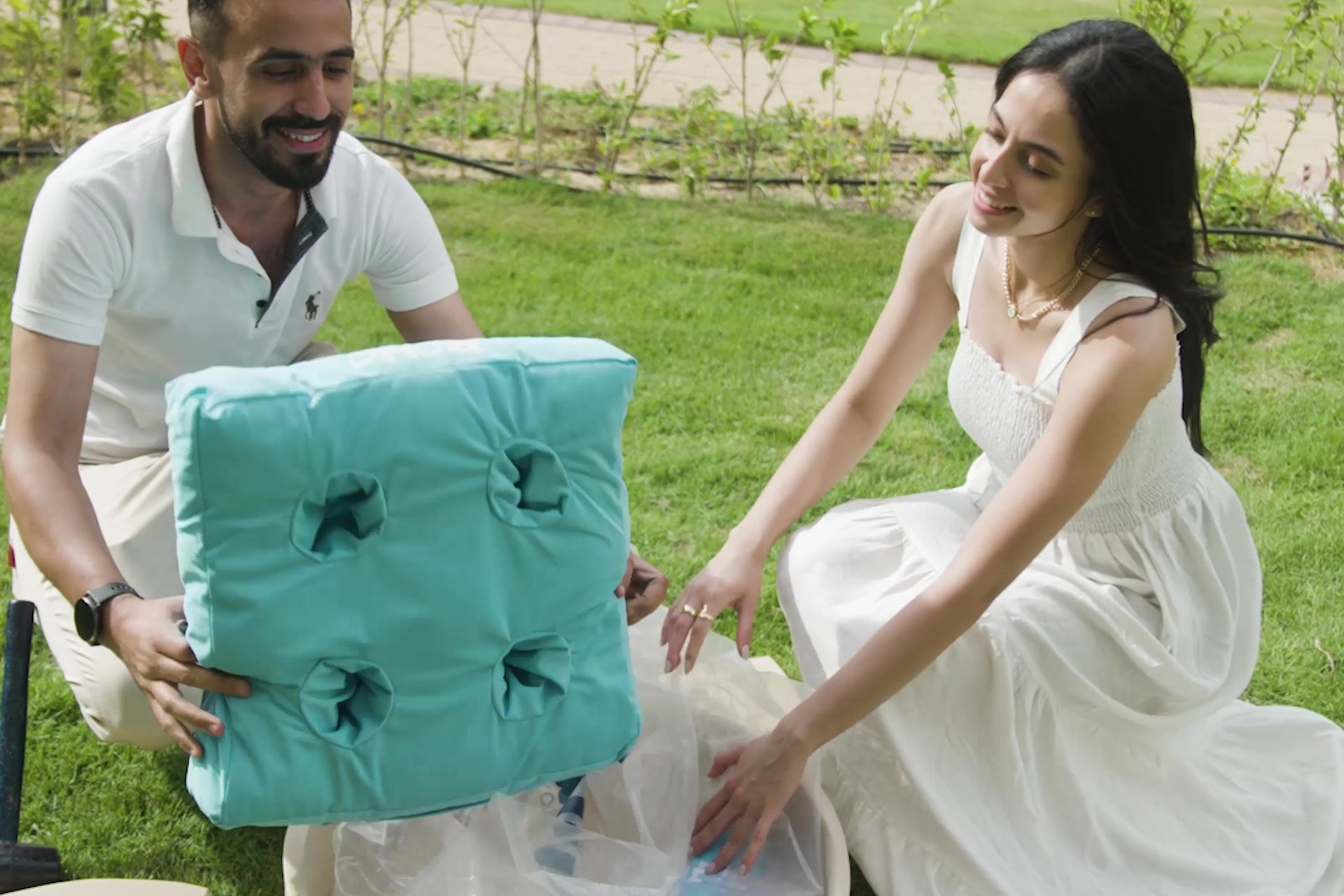 BOHO homeowners opening a welcome gift during their delivery experience