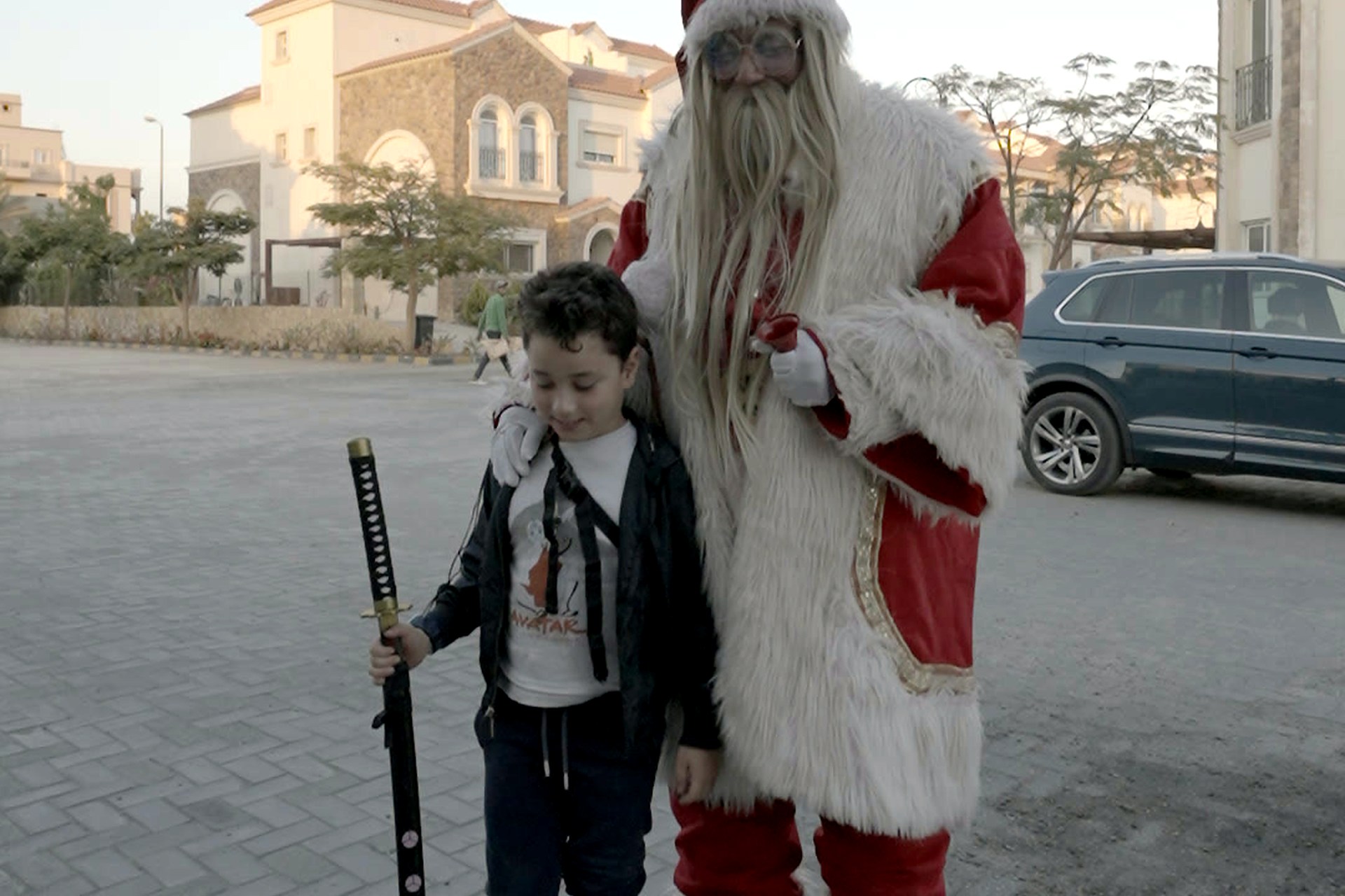 A child meeting Santa during the Divina Gardens Christmas gift distribution