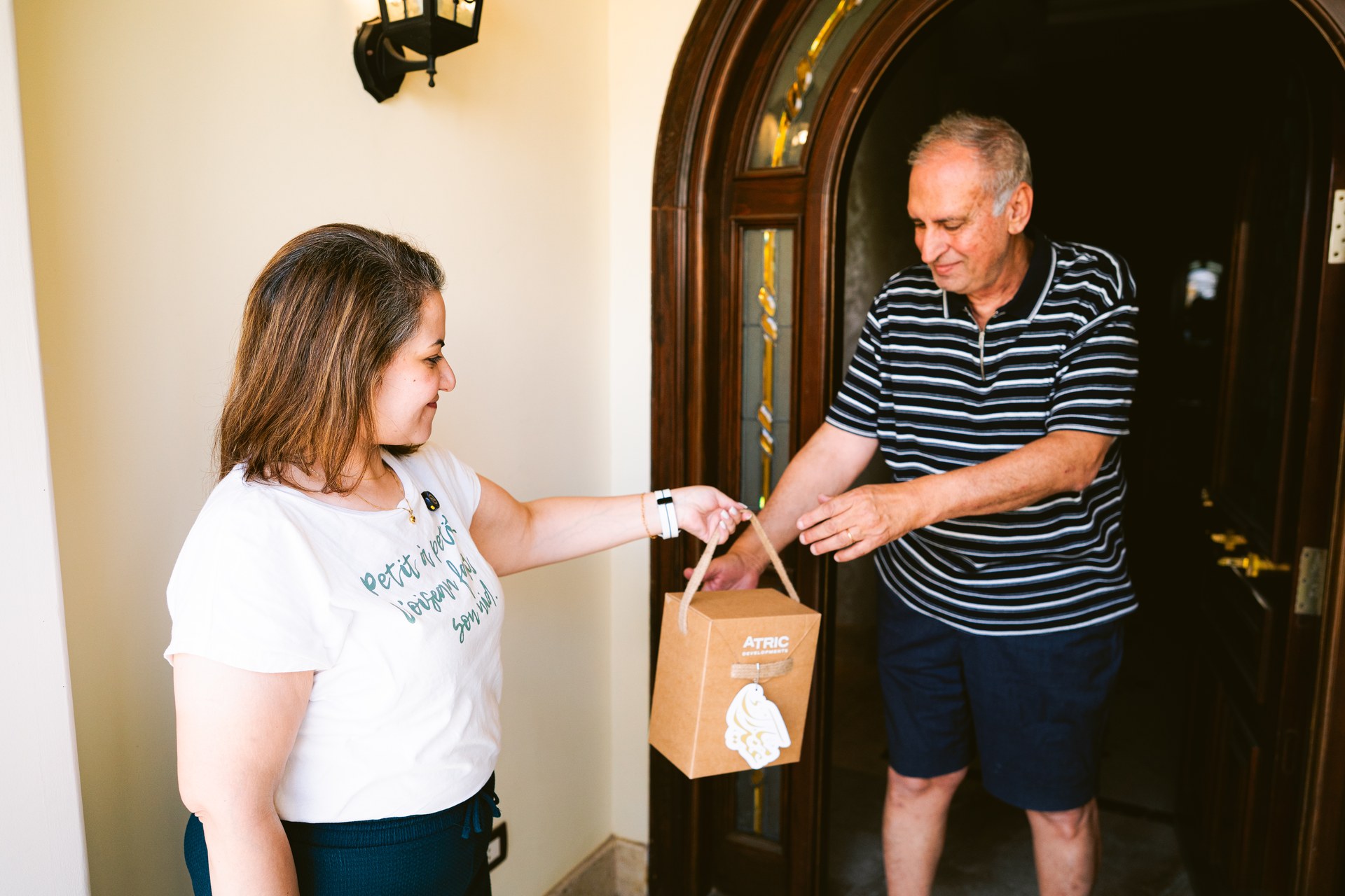 A Divina Gardens resident receiving a festive gift from ATRIC