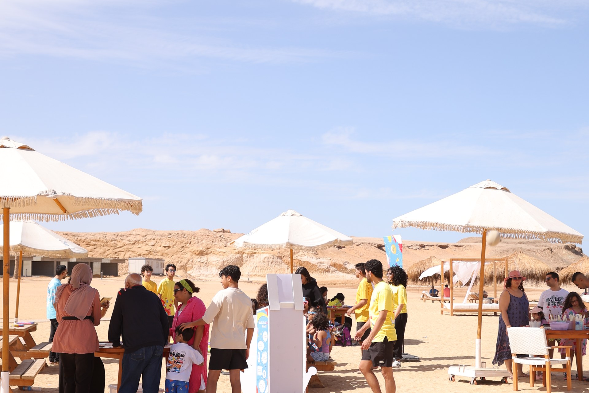 Families enjoying Eid Al-Fitr activities on the beach at BOHO Sokhna