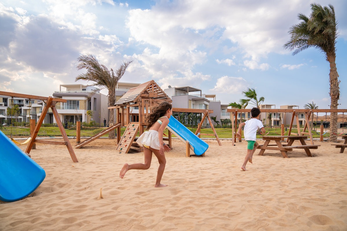 Children playing in BOHO Sokhna's sandy kids area